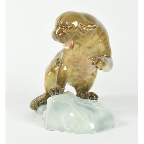 34 - A 20th century Beswick gloss finish figurine of a puma on a rock.
20cm x 15cm approx.