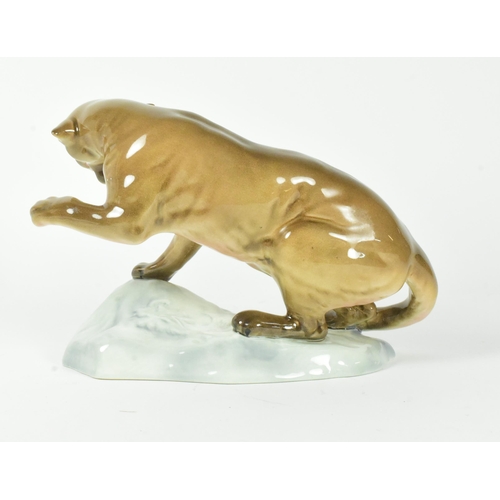 34 - A 20th century Beswick gloss finish figurine of a puma on a rock.
20cm x 15cm approx.