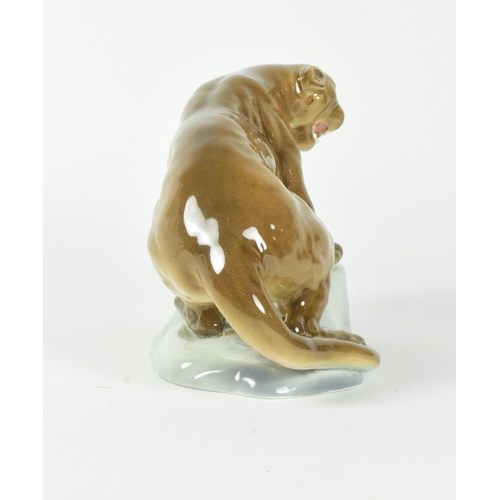 34 - A 20th century Beswick gloss finish figurine of a puma on a rock.
20cm x 15cm approx.