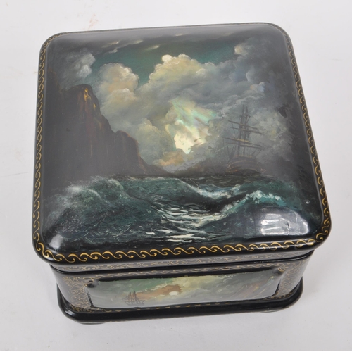 342 - A modern circa 2003 Russian paper-mache lacquer box. The box of square shape, with lacquered painted... 