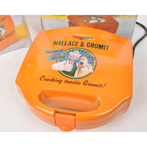 357 - Wallace & Gromit - Aardman - Two modern Wallace and Gromit sandwich toaster / toastie maker. Wit... 