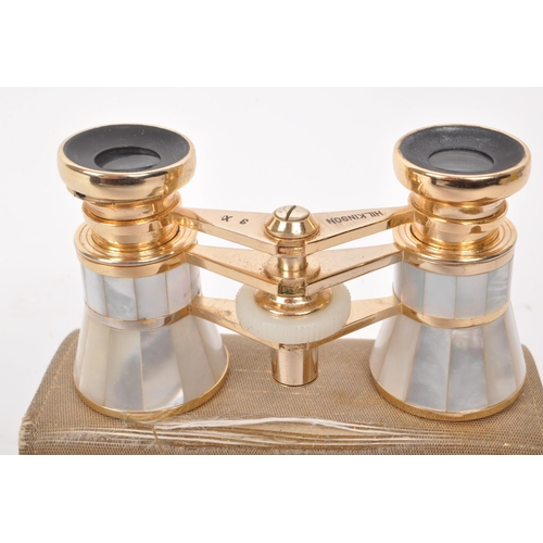 358 - A vintage 20th century Hilkinson 3x inlaid mother of pearl opera binoculars, and yellw metal mesh pu... 