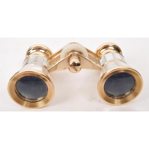 358 - A vintage 20th century Hilkinson 3x inlaid mother of pearl opera binoculars, and yellw metal mesh pu... 