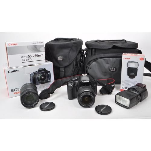 359 - Canon - A circa 2008 Canon 450D APS-C DSLR camera, alongside a selection of lenses and accessories. ... 