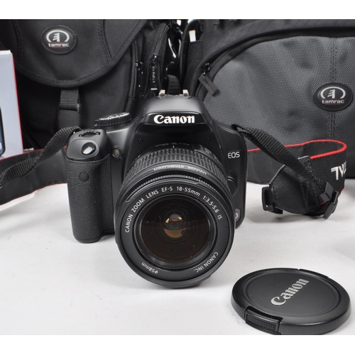 359 - Canon - A circa 2008 Canon 450D APS-C DSLR camera, alongside a selection of lenses and accessories. ... 