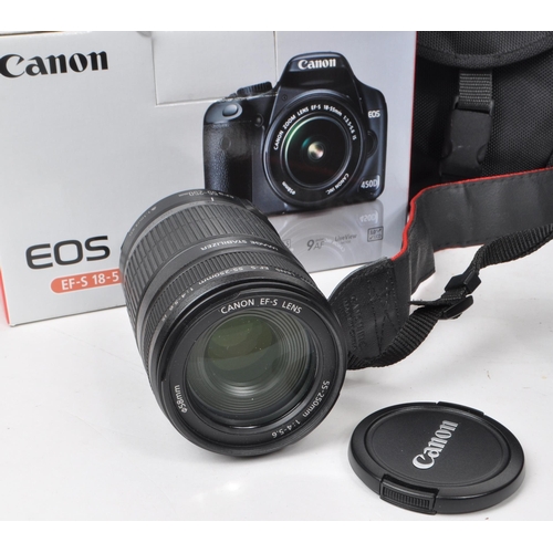 359 - Canon - A circa 2008 Canon 450D APS-C DSLR camera, alongside a selection of lenses and accessories. ... 