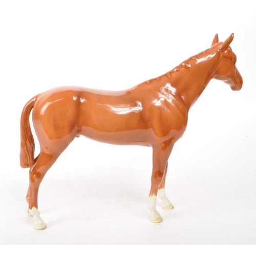 36 - Beswick - A 1940s china Bois Rousell Racehorse no. 701 figurine. Featuring a chestnut colour, a Besw... 