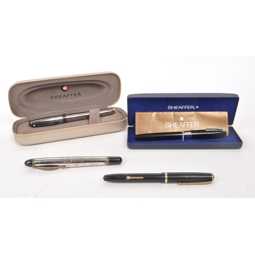 360 - Sheaffer - Two vintage 20th century Sheaffer fountain pens, alongside two other examples. Each Sheaf... 