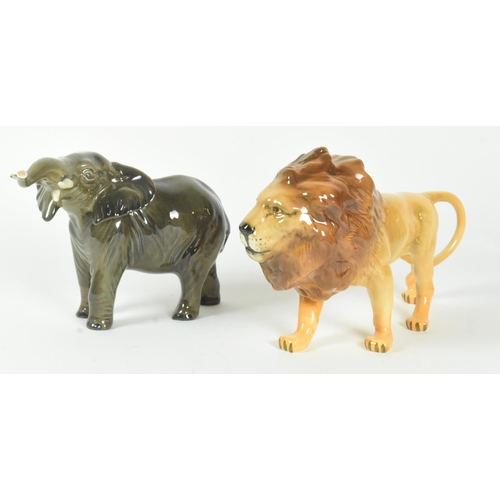 37 - A set of two Beswick 20th century animal figurines. Includes a lion and and elephant with a gloss fi... 