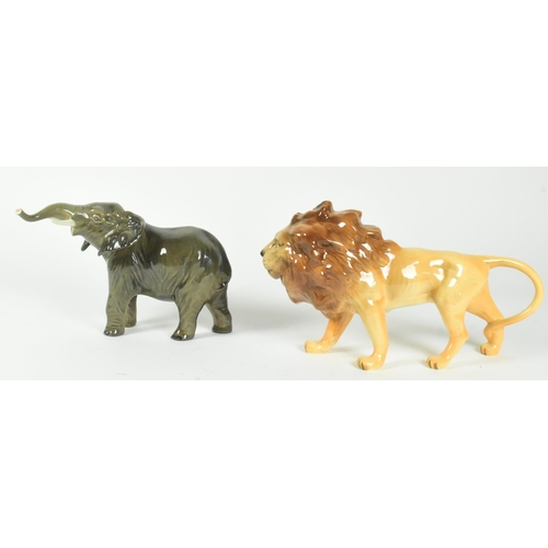 37 - A set of two Beswick 20th century animal figurines. Includes a lion and and elephant with a gloss fi... 