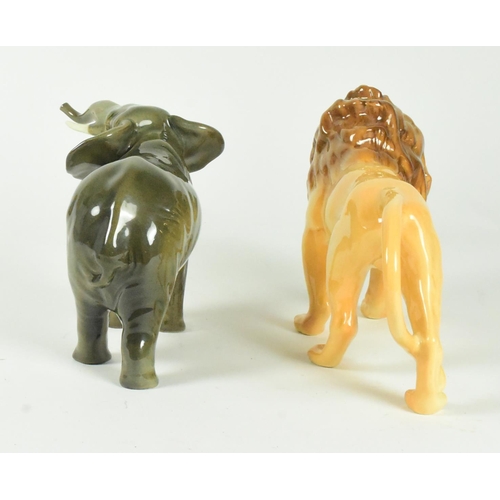 37 - A set of two Beswick 20th century animal figurines. Includes a lion and and elephant with a gloss fi... 