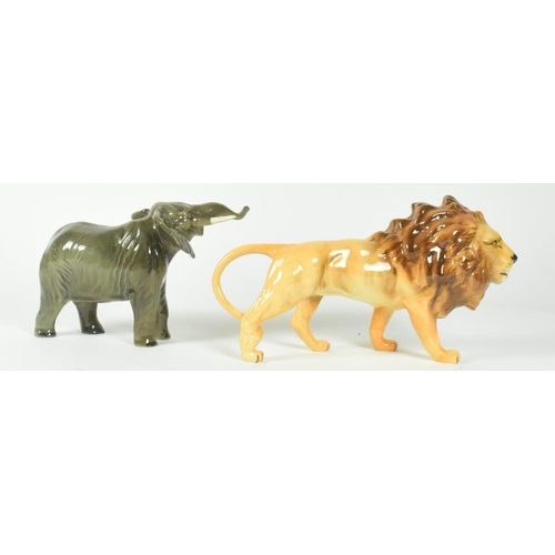 37 - A set of two Beswick 20th century animal figurines. Includes a lion and and elephant with a gloss fi... 