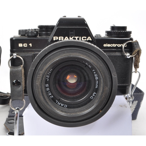 374 - Praktica - Two vintage 20th century Praktica cameras and lenses. The collection to include a Praktic... 