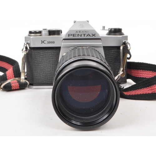 375 - Pentax - A vintage 20th century Asahi Pentax K1000 35mm SLR camera. The camera alongside Pentax 200m... 