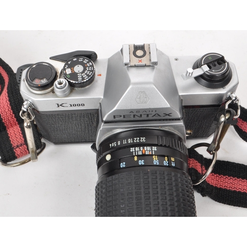 375 - Pentax - A vintage 20th century Asahi Pentax K1000 35mm SLR camera. The camera alongside Pentax 200m... 