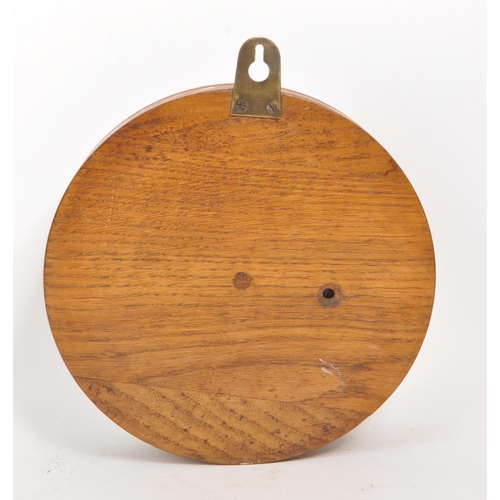 376 - A late 19th century Victorian aneroid barometer, mounted on an oak plinth base, with brass mounts an... 