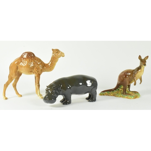 38 - A selection of Beswick glossy finish 20th century animal figurines. Includes a camel, hippo, and kan... 