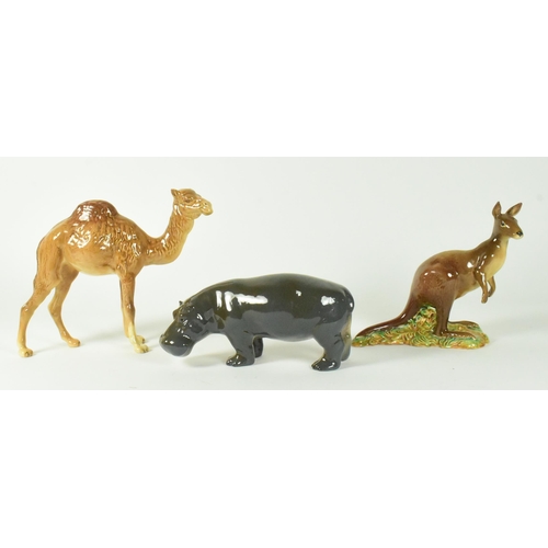 38 - A selection of Beswick glossy finish 20th century animal figurines. Includes a camel, hippo, and kan... 