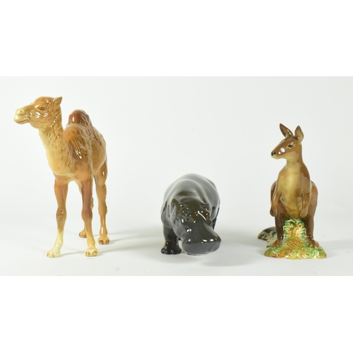 38 - A selection of Beswick glossy finish 20th century animal figurines. Includes a camel, hippo, and kan... 