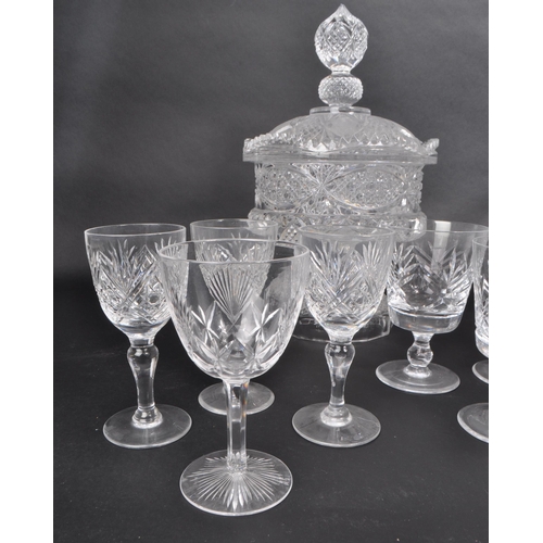 380 - A collection of 20th century crystal glass pieces, including a lidded pedestal punch bowl, a basket,... 