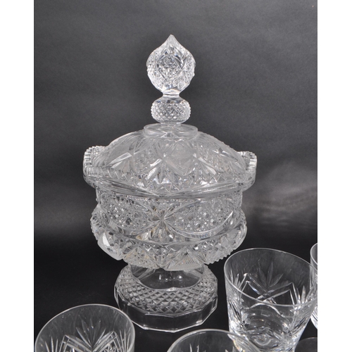 380 - A collection of 20th century crystal glass pieces, including a lidded pedestal punch bowl, a basket,... 