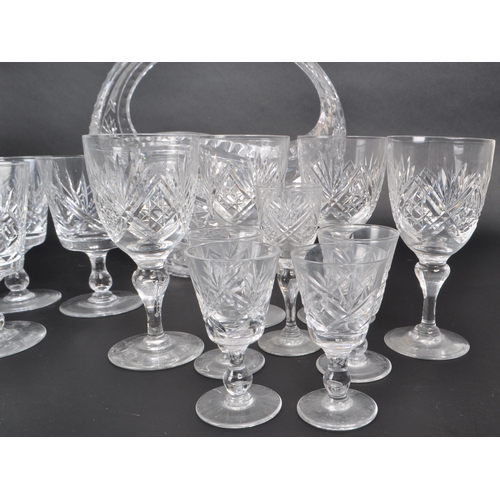 380 - A collection of 20th century crystal glass pieces, including a lidded pedestal punch bowl, a basket,... 