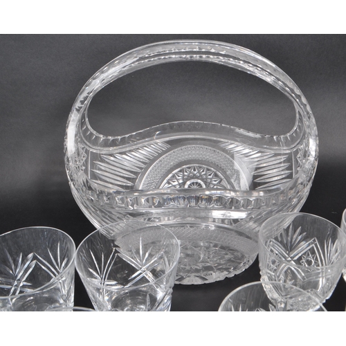 380 - A collection of 20th century crystal glass pieces, including a lidded pedestal punch bowl, a basket,... 