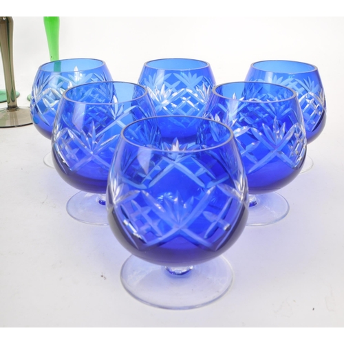 383 - Large collection of vintage 20th century coloured crystal cut glass drinking glasses. Fleur de lis p... 