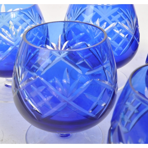 383 - Large collection of vintage 20th century coloured crystal cut glass drinking glasses. Fleur de lis p... 