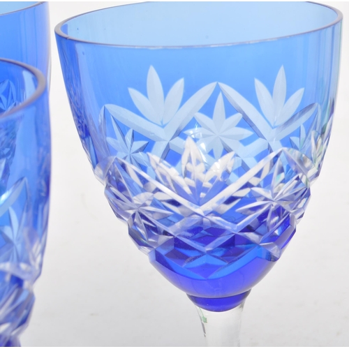 383 - Large collection of vintage 20th century coloured crystal cut glass drinking glasses. Fleur de lis p... 