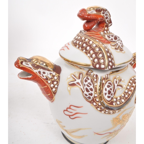 385 - Three vintage 20th century Japanese dragon porcelain teapots. Having white ground with high reflie d... 