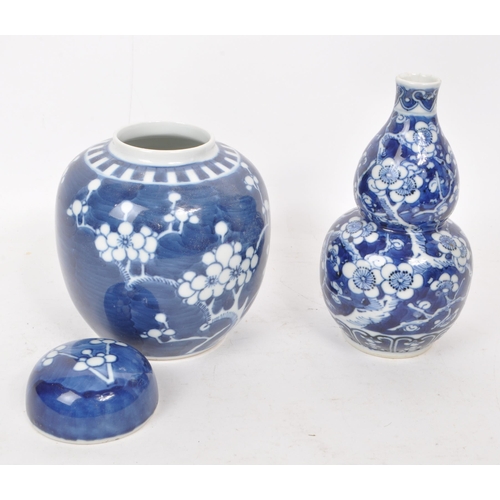 389 - Two early 20th century Chinese porcelain blue & white prunus ginger jar and vase. One example is... 