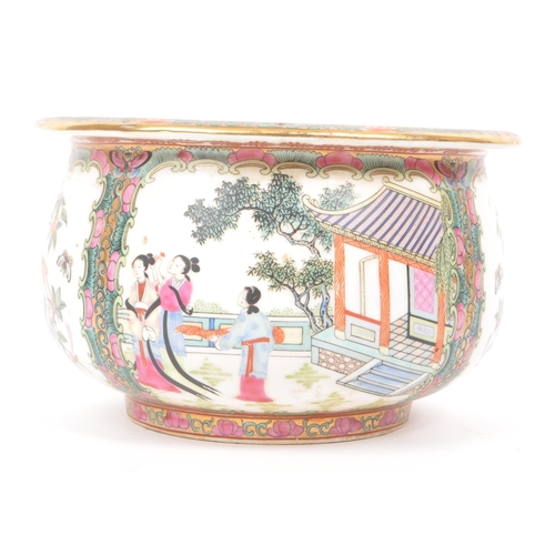 39 - A 1920s Chinese porcelain centre bowl / planter, decorated in traditional Chinese figures and floral... 