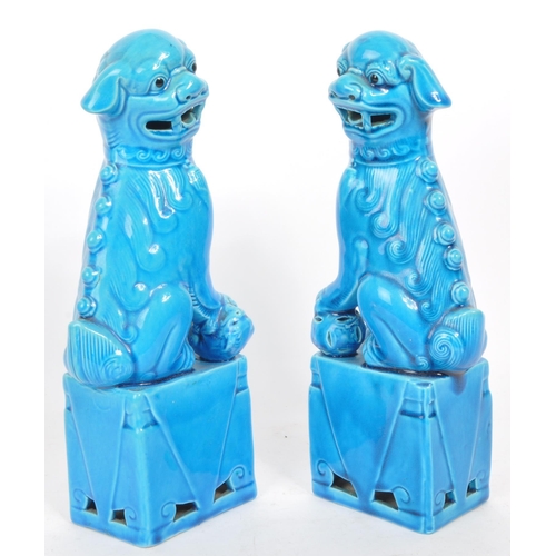 390 - Two vintage 20th century blue glazed Chinese Guardian Temple Fu Dogs. Raised on pedestal bases, with... 