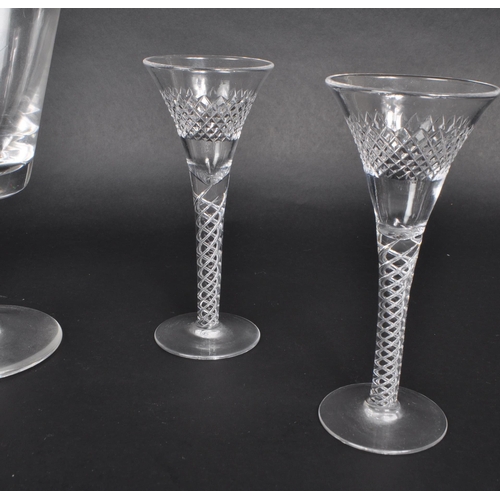 391 - A collection of seven 19th century George III cut glass pieces, comprised of four crystal twist stem... 