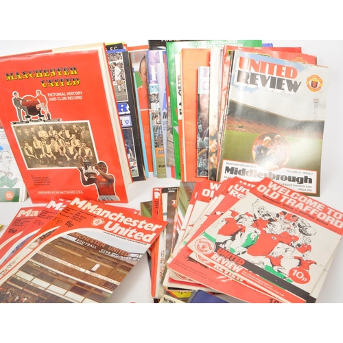 396 - A collection of late 20th century football programmes, majority being Manchester United, with other ... 