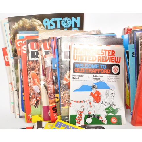 396 - A collection of late 20th century football programmes, majority being Manchester United, with other ... 