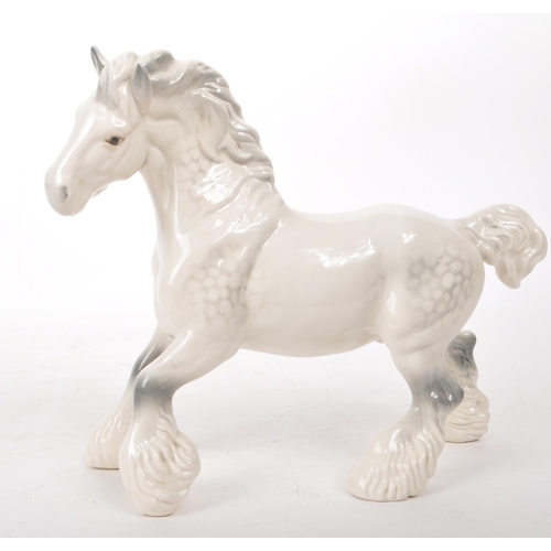 40 - Beswick - A 20th-century china grey gloss cantering shire horse no. 975, designed by Arthur Gredingt... 