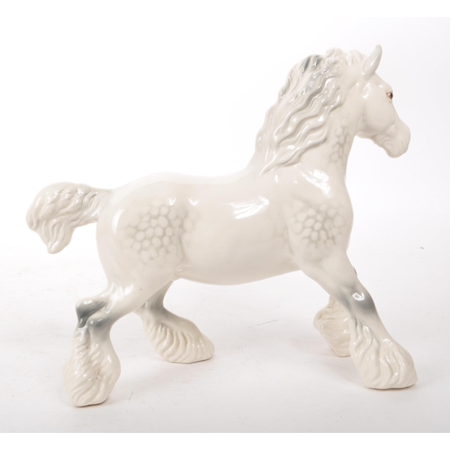 40 - Beswick - A 20th-century china grey gloss cantering shire horse no. 975, designed by Arthur Gredingt... 