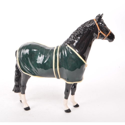 41 - Beswick - A 1999 black gloss china 'Champion Welsh Mountain Pony' limited edition out of 580. Makers... 