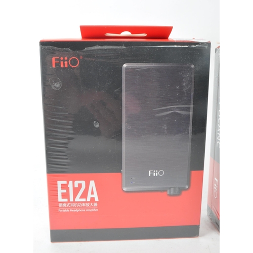 414 - Two 2013 / 2014 FiiO E12 mont blanc and E12A mont blanc for IEM portable headphone amplifiers. Profe... 