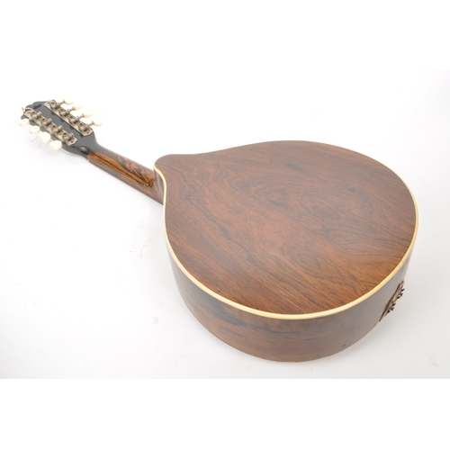 421 - A vintage 20th century flat backed mandolin instrument with an inlaid floral scratch plate, inlaid m... 