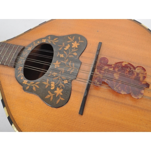 421 - A vintage 20th century flat backed mandolin instrument with an inlaid floral scratch plate, inlaid m... 