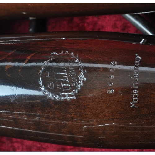 426 - G. H. Hüller Schöneck - An early 20th century German Bassoon with metal mounts, no.56494. Housed wit... 