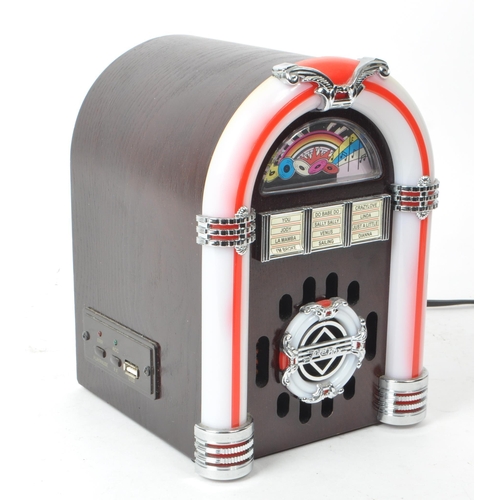 427 - Steepletone - A 20th century model USB SUB LED miniature table top jukebox. With a wooden body, ligh... 