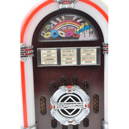 427 - Steepletone - A 20th century model USB SUB LED miniature table top jukebox. With a wooden body, ligh... 