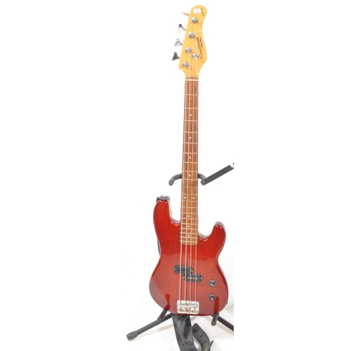 428 - A Tanglewood Elfin EB 18 bass guitar, in red with a leather strap, and a Hiwatt Maxwatt G20 8R guita... 