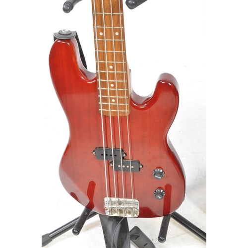 428 - A Tanglewood Elfin EB 18 bass guitar, in red with a leather strap, and a Hiwatt Maxwatt G20 8R guita... 