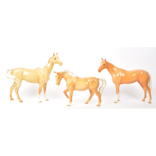 43 - Beswick - A collection of three 20th-century china Palomino horse pony figurines, comprising of two ... 