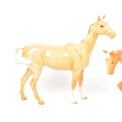 43 - Beswick - A collection of three 20th-century china Palomino horse pony figurines, comprising of two ... 